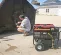 Red and black MI-T-M 7,500-7,900 W Portable Generator, Gas