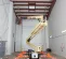 Beige and orange JLG Boom